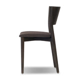 Inspired by simple Scandinavian styling, a dark-finished parawood stool's slit-back metal inlay adds a decorative touch. Easy curves from bent wood give a smooth silhouette. Upholstered with a thin seat cushion upholstered in black performance fabric, perfect for everyday dining. Amethyst Home provides interior design, new home construction design consulting, vintage area rugs, and lighting in the Des Moines metro area.