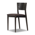 Inspired by simple Scandinavian styling, a dark-finished parawood stool's slit-back metal inlay adds a decorative touch. Easy curves from bent wood give a smooth silhouette. Upholstered with a thin seat cushion upholstered in black performance fabric, perfect for everyday dining. Amethyst Home provides interior design, new home construction design consulting, vintage area rugs, and lighting in the Houston metro area.
