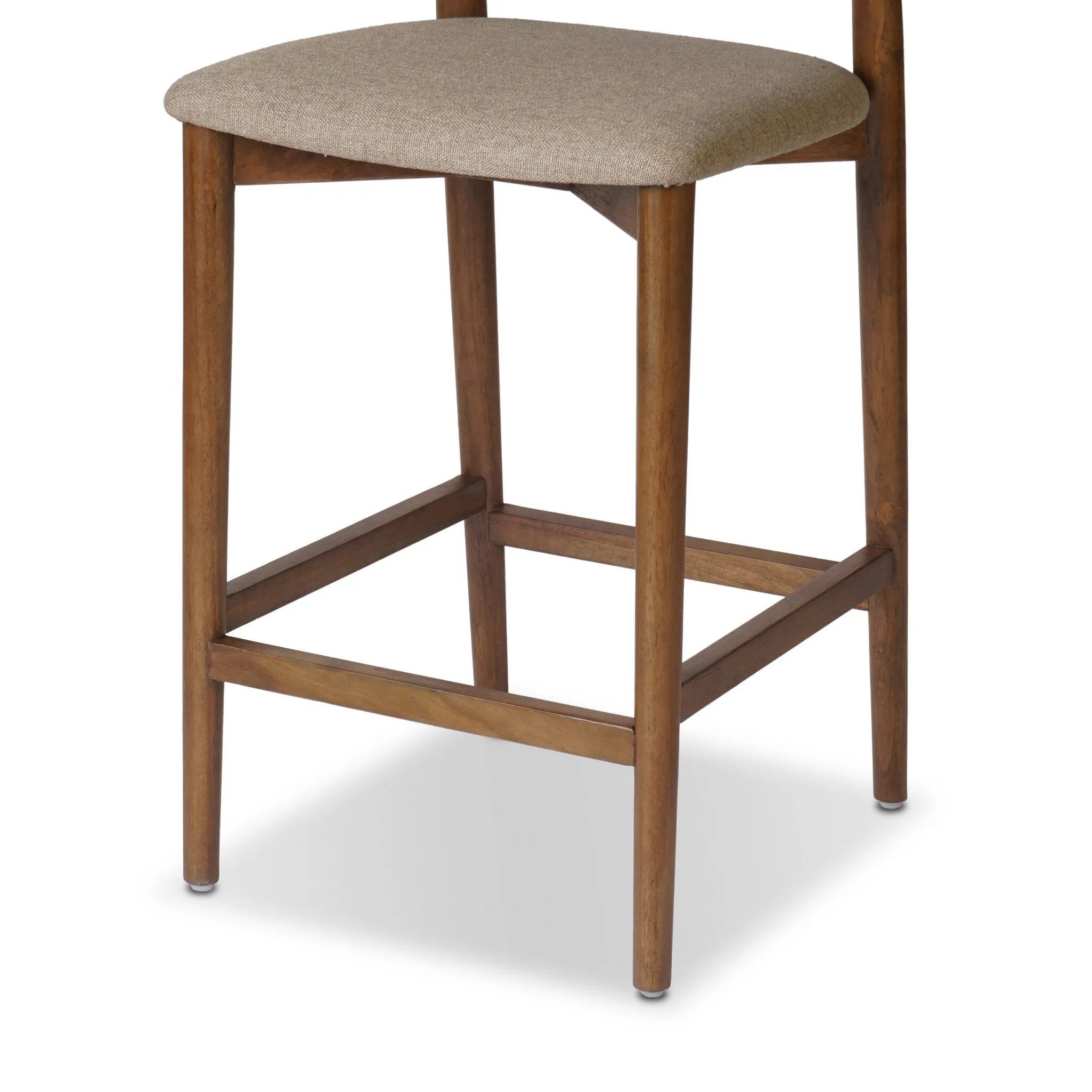 Inspired by simple Scandinavian styling, a tan-finished parawood stool's slit-back metal inlay adds a decorative touch. Easy curves from bent wood give a smooth silhouette. Sized for the counter and upholstered with a thin seat cushion in linen-cotton taupe Amethyst Home provides interior design, new home construction design consulting, vintage area rugs, and lighting in the Calabasas metro area.
