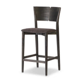 Inspired by simple Scandinavian styling, a dark-finished parawood stool's slit-back metal inlay adds a decorative touch. Easy curves from bent wood give a smooth silhouette. Sized for the counter and upholstered with a thin seat cushion upholstered in black performance fabric, perfect for dining or entertaining. Amethyst Home provides interior design, new home construction design consulting, vintage area rugs, and lighting in the Des Moines metro area.