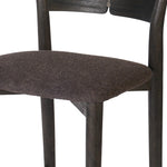 Inspired by simple Scandinavian styling, a dark-finished parawood stool's slit-back metal inlay adds a decorative touch. Easy curves from bent wood give a smooth silhouette. Sized for the counter and upholstered with a thin seat cushion upholstered in black performance fabric, perfect for dining or entertaining. Amethyst Home provides interior design, new home construction design consulting, vintage area rugs, and lighting in the Miami metro area.