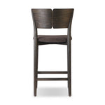 Inspired by simple Scandinavian styling, a dark-finished parawood stool's slit-back metal inlay adds a decorative touch. Easy curves from bent wood give a smooth silhouette. Sized for the counter and upholstered with a thin seat cushion upholstered in black performance fabric, perfect for dining or entertaining. Amethyst Home provides interior design, new home construction design consulting, vintage area rugs, and lighting in the Park City metro area.