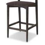 Inspired by simple Scandinavian styling, a dark-finished parawood stool's slit-back metal inlay adds a decorative touch. Easy curves from bent wood give a smooth silhouette. Sized for the counter and upholstered with a thin seat cushion upholstered in black performance fabric, perfect for dining or entertaining. Amethyst Home provides interior design, new home construction design consulting, vintage area rugs, and lighting in the Salt Lake City metro area.
