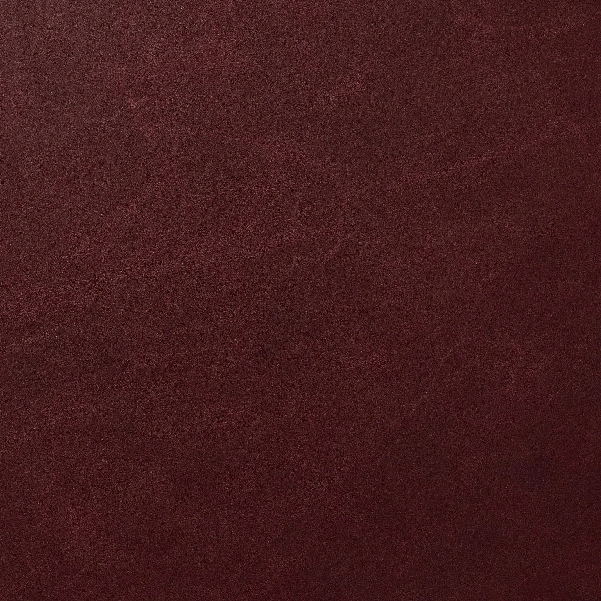 A bold chair design inspired by Italian modernism. Made from burgundy top-grain leather, with a wide format that contrasts slimmer chamfered legs leaving airiness underneath. The result: A beautiful balance of scale.As enthusiasts of clean aesthetics at Amethyst, we love the warm modern inspired Graford Chair - Dulane Burgundy. Amethyst Home provides interior design, new home construction design consulting, vintage area rugs, and lighting in the Miami metro area.