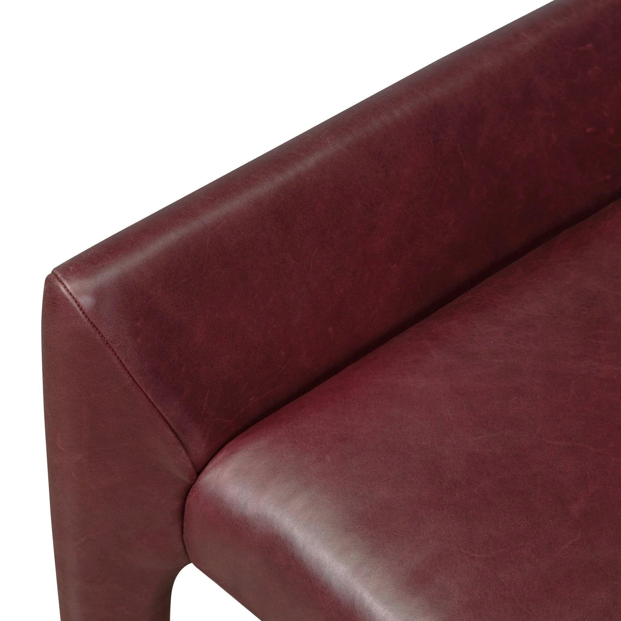 A bold dining chair design inspired by Italian modernism. Made from burgundy top-grain leather, with a wide format that contrasts slimmer chamfered legs leaving airiness underneath. The result: A beautiful balance of scale.As enthusiasts of luxe aesthetics at Amethyst, we love the warm modern inspired Graford Dining Chair - Dulane Burgundy. Amethyst Home provides interior design, new home construction design consulting, vintage area rugs, and lighting in the Dallas metro area.