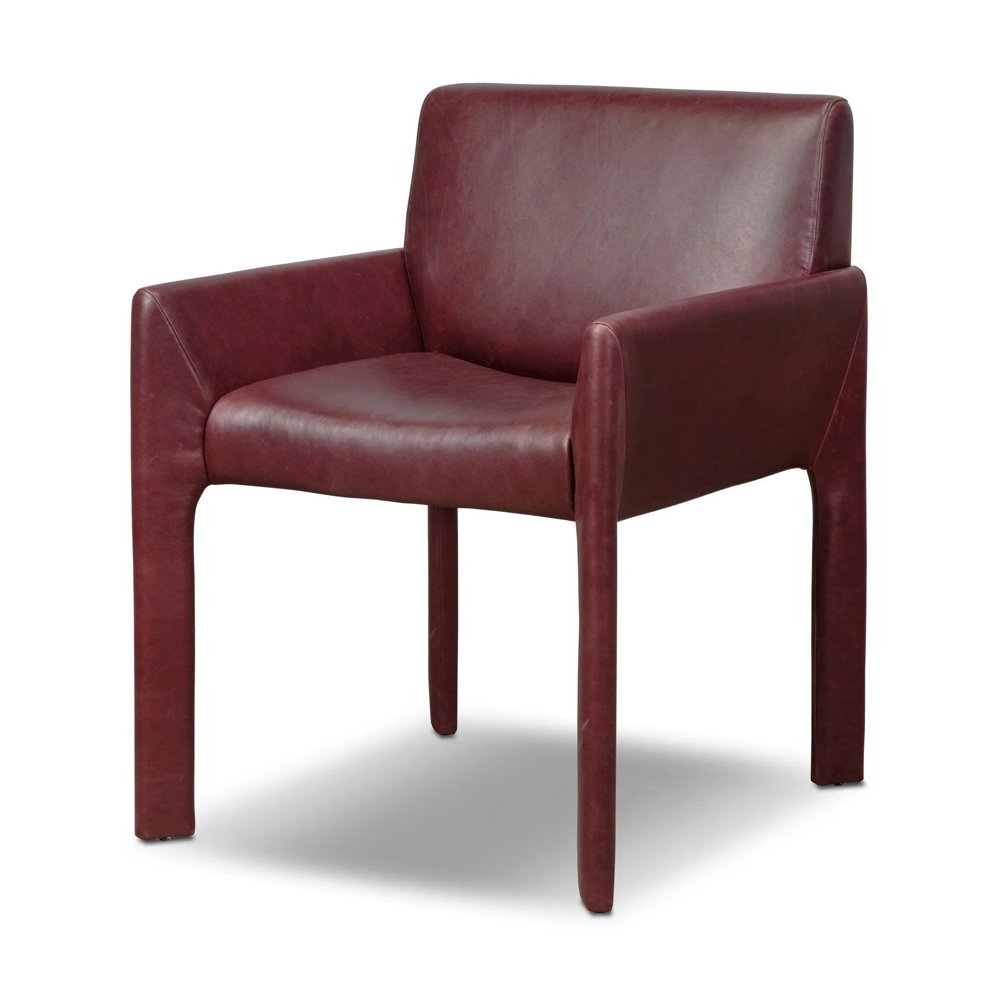 A bold dining chair design inspired by Italian modernism. Made from burgundy top-grain leather, with a wide format that contrasts slimmer chamfered legs leaving airiness underneath. The result: A beautiful balance of scale.As enthusiasts of luxe aesthetics at Amethyst, we love the warm modern inspired Graford Dining Chair - Dulane Burgundy. Amethyst Home provides interior design, new home construction design consulting, vintage area rugs, and lighting in the Laguna Beach metro area.