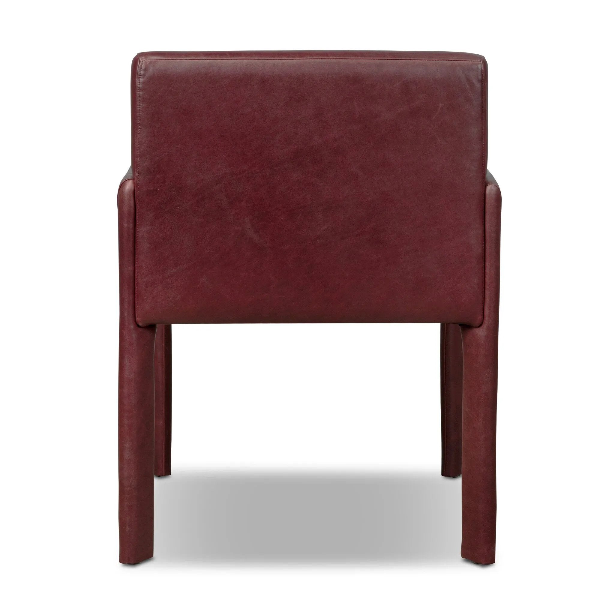 A bold dining chair design inspired by Italian modernism. Made from burgundy top-grain leather, with a wide format that contrasts slimmer chamfered legs leaving airiness underneath. The result: A beautiful balance of scale.As enthusiasts of luxe aesthetics at Amethyst, we love the warm modern inspired Graford Dining Chair - Dulane Burgundy. Amethyst Home provides interior design, new home construction design consulting, vintage area rugs, and lighting in the Monterey metro area.