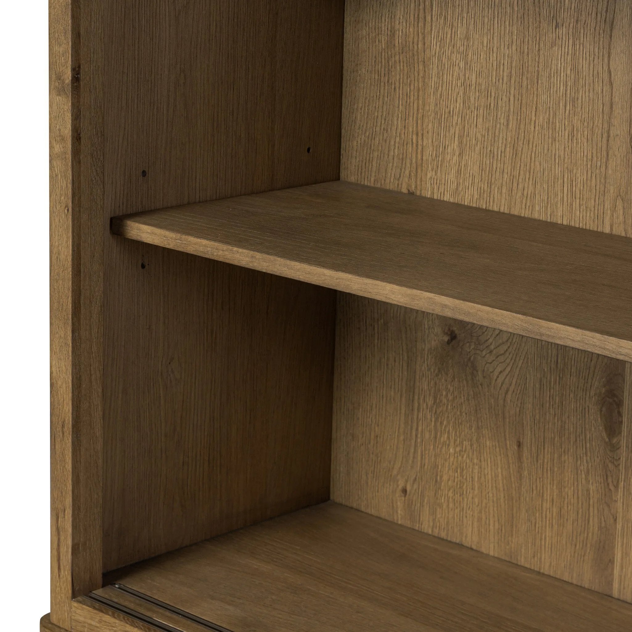 Large, traditional cabinetry of honey-finished oak brings a timeless look — and plenty of storage — to any room in the house. Sliding glass doors modernize this heritage-inspired piece, so you can style your favorite books and belongings. Six roomy drawers create endless storage possibilities for your space Amethyst Home provides interior design, new home construction design consulting, vintage area rugs, and lighting in the Park City metro area.
