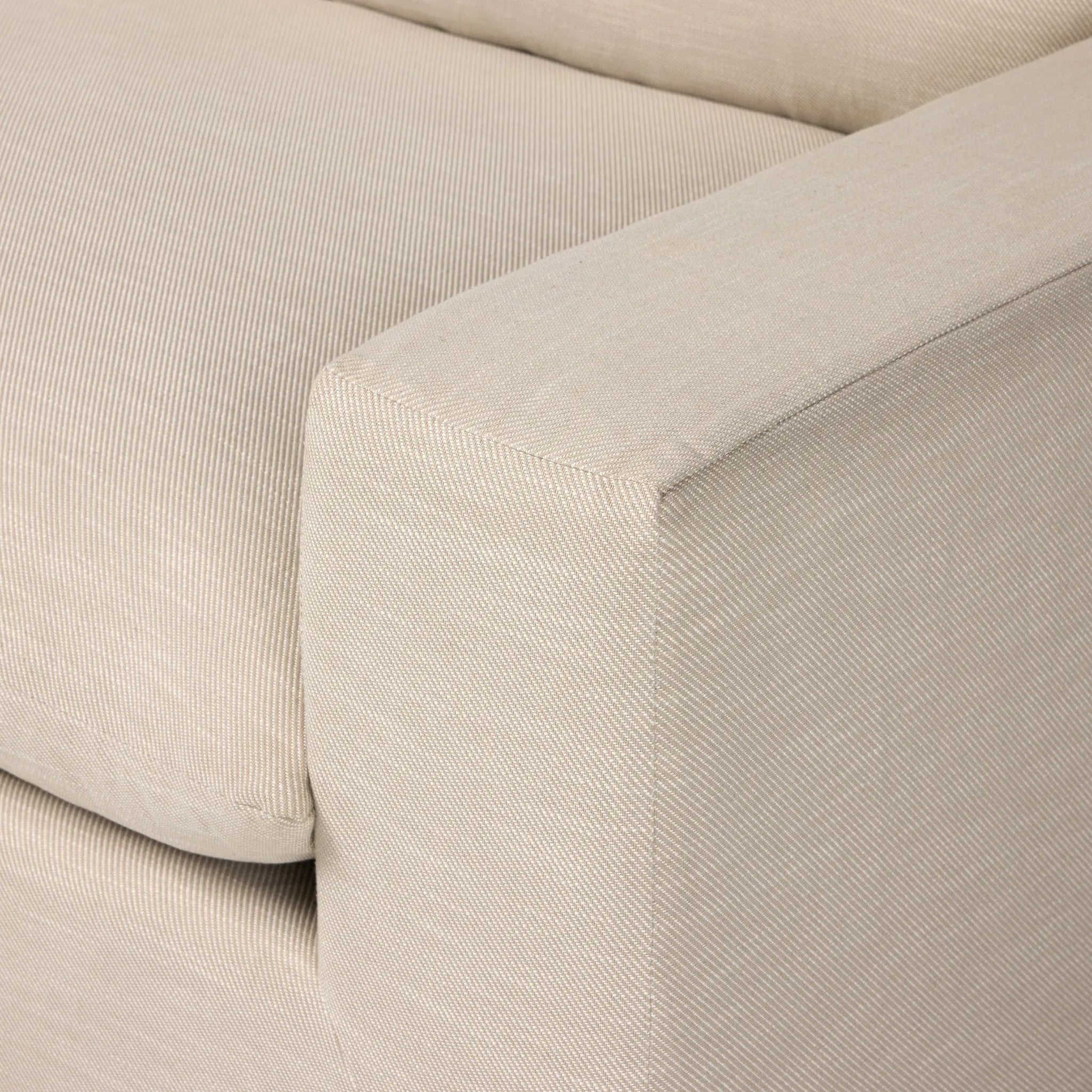 Welcome to the modern lounging essential. A timeless track arm sofa is upholstered in a neutral oatmeal performance fabric and finished with wooden block legs. Performance fabrics are specially created to withstand spills, stains, high traffic and wear, ensuring long-term comfort and unmatched durability Amethyst Home provides interior design, new home construction design consulting, vintage area rugs, and lighting in the Dallas metro area.