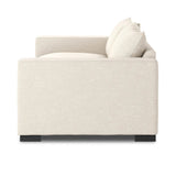 Welcome to the modern lounging essential. A timeless track arm sofa is upholstered in a neutral oatmeal performance fabric and finished with wooden block legs. Performance fabrics are specially created to withstand spills, stains, high traffic and wear, ensuring long-term comfort and unmatched durability Amethyst Home provides interior design, new home construction design consulting, vintage area rugs, and lighting in the Monterey metro area.