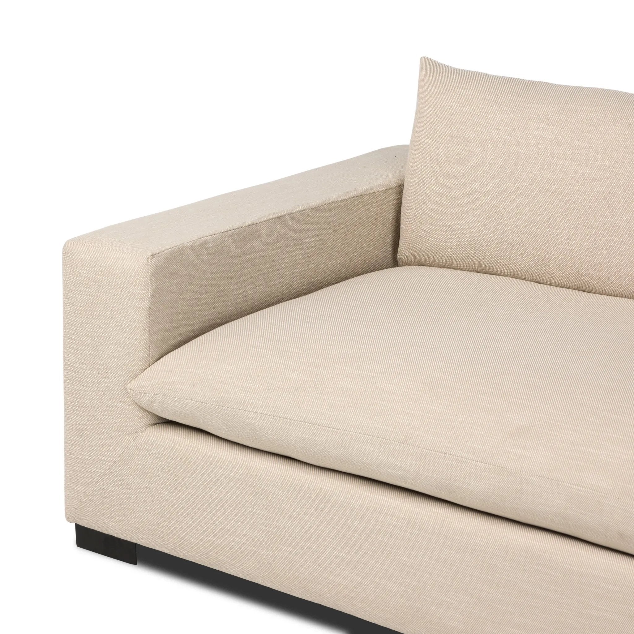 Welcome to the modern lounging essential. A timeless track arm sofa is upholstered in a neutral oatmeal performance fabric and finished with wooden block legs. Performance fabrics are specially created to withstand spills, stains, high traffic and wear, ensuring long-term comfort and unmatched durability Amethyst Home provides interior design, new home construction design consulting, vintage area rugs, and lighting in the Seattle metro area.