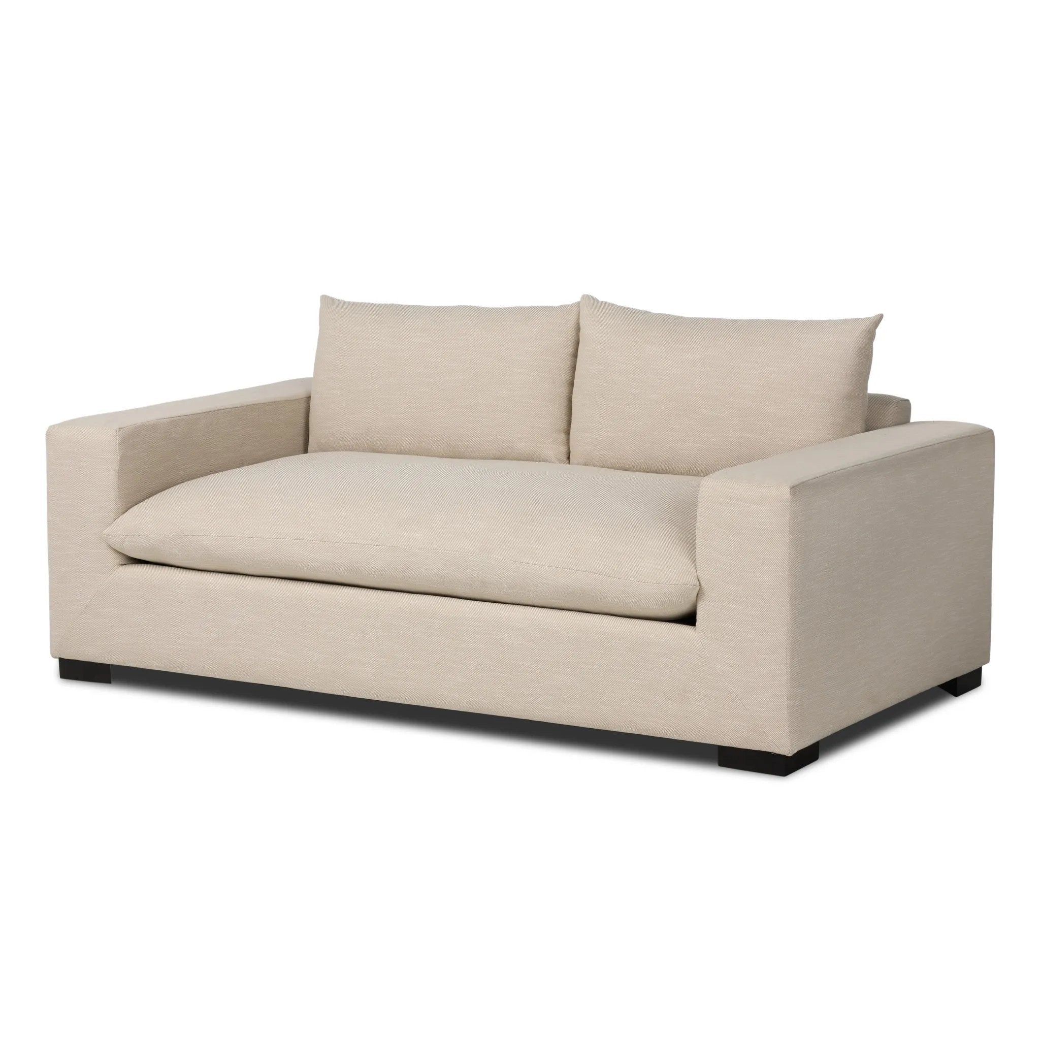 Welcome to the modern lounging essential. A timeless track arm sofa is upholstered in a neutral oatmeal performance fabric and finished with wooden block legs. Performance fabrics are specially created to withstand spills, stains, high traffic and wear, ensuring long-term comfort and unmatched durability Amethyst Home provides interior design, new home construction design consulting, vintage area rugs, and lighting in the Tampa metro area.