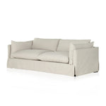 A slipcovered sofa made for modern living. Shelter arms and big, pillow-inspired cushions are covered in a durable comfortable fabric prime for lounging. Performance fabrics are specially created to withstand spills, stains, high traffic and wear, ensuring long-term comfort and unmatched durability Amethyst Home provides interior design, new home construction design consulting, vintage area rugs, and lighting in the Alpharetta metro area.