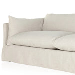 A slipcovered sofa made for modern living. Shelter arms and big, pillow-inspired cushions are covered in a durable comfortable fabric prime for lounging. Performance fabrics are specially created to withstand spills, stains, high traffic and wear, ensuring long-term comfort and unmatched durability Amethyst Home provides interior design, new home construction design consulting, vintage area rugs, and lighting in the Charlotte metro area.