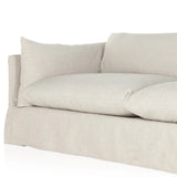 A slipcovered sofa made for modern living. Shelter arms and big, pillow-inspired cushions are covered in a durable comfortable fabric prime for lounging. Performance fabrics are specially created to withstand spills, stains, high traffic and wear, ensuring long-term comfort and unmatched durability Amethyst Home provides interior design, new home construction design consulting, vintage area rugs, and lighting in the Charlotte metro area.