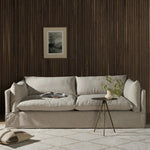 A slipcovered sofa made for modern living. Shelter arms and big, pillow-inspired cushions are covered in a durable comfortable fabric prime for lounging. Performance fabrics are specially created to withstand spills, stains, high traffic and wear, ensuring long-term comfort and unmatched durability Amethyst Home provides interior design, new home construction design consulting, vintage area rugs, and lighting in the Los Angeles metro area.