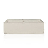 A slipcovered sofa made for modern living. Shelter arms and big, pillow-inspired cushions are covered in a durable comfortable fabric prime for lounging. Performance fabrics are specially created to withstand spills, stains, high traffic and wear, ensuring long-term comfort and unmatched durability Amethyst Home provides interior design, new home construction design consulting, vintage area rugs, and lighting in the Portland metro area.