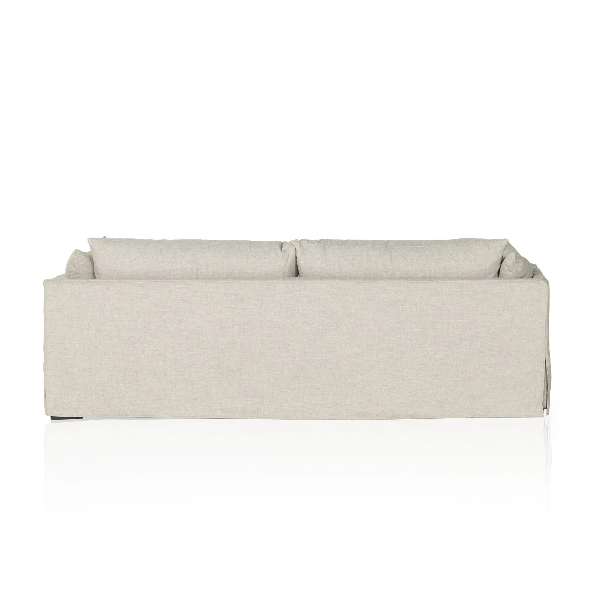 A slipcovered sofa made for modern living. Shelter arms and big, pillow-inspired cushions are covered in a durable comfortable fabric prime for lounging. Performance fabrics are specially created to withstand spills, stains, high traffic and wear, ensuring long-term comfort and unmatched durability Amethyst Home provides interior design, new home construction design consulting, vintage area rugs, and lighting in the Portland metro area.