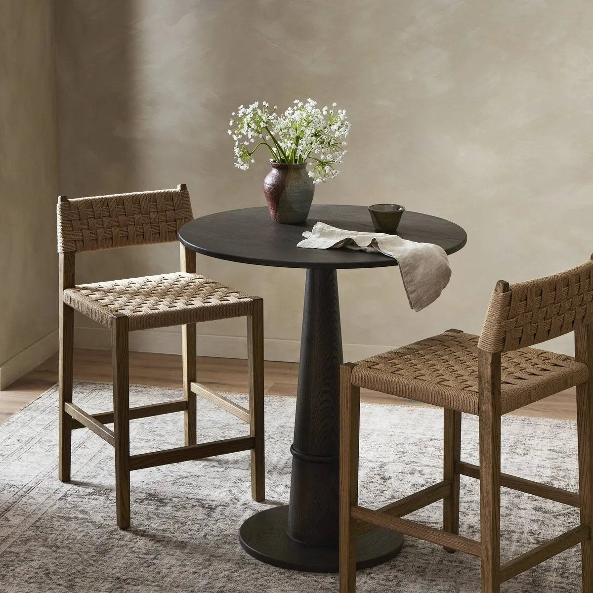 Featuring Hamlin Double Twisted Paper Cord Bar Stool by Four Hands at Amethyst Home. The Hamlin Double Twisted Paper Cord Bar Stool is expertly crafted with durable, high-quality materials. Its unique cord design provides both style and support, making it the perfect addition to any space. With its sturdy construction, this stool offers long-lasting us. Amethyst Home provides interior design, new home construction design consulting, vintage area rugs, and lighting in the Salt Lake City metro area.