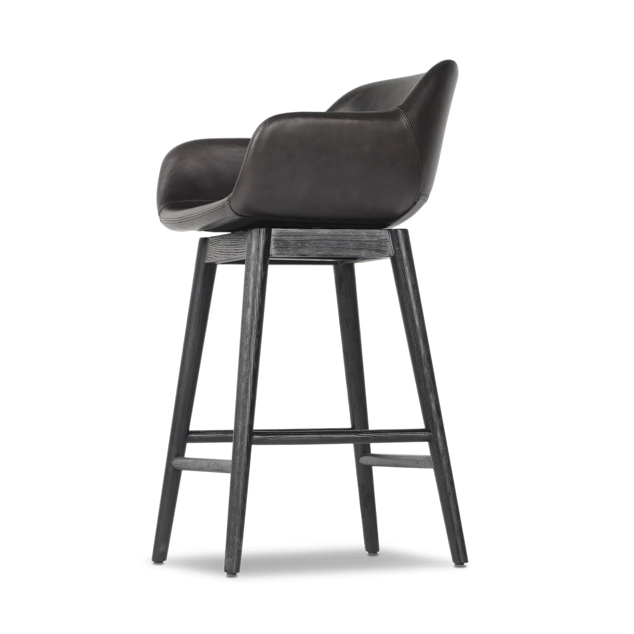 Featuring Hannah Sonoma Black Swivel Bar + Counter Stool by Four Hands at Amethyst Home. BarOverall Dimensions: 21.75"w x 20.50"d x 40.75"hWeight: 23.81 lbsCounterOverall Dimensions: 21.75"w x 20.50"d x 36.75"hWeight: 21.61 lbsMaterials: Top Grain Leather, Solid Oak, Solid Ash. Amethyst Home provides interior design, new home construction design consulting, vintage area rugs, and lighting in the Kansas City metro area.