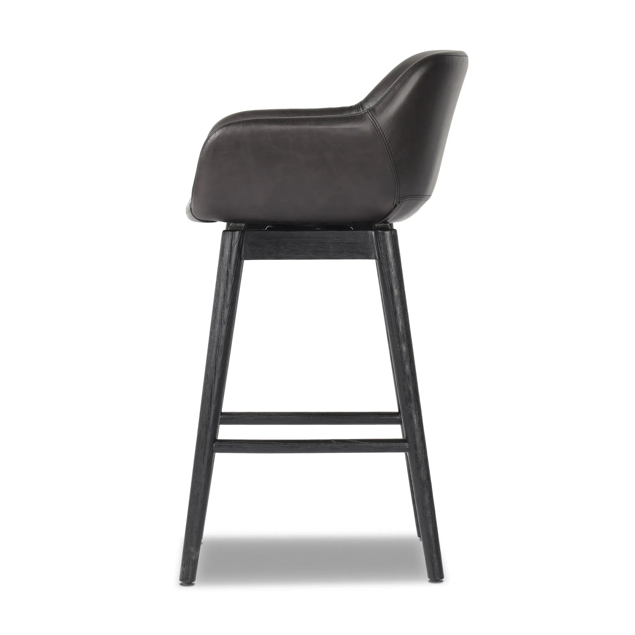 Featuring Hannah Sonoma Black Swivel Bar + Counter Stool by Four Hands at Amethyst Home. BarOverall Dimensions: 21.75"w x 20.50"d x 40.75"hWeight: 23.81 lbsCounterOverall Dimensions: 21.75"w x 20.50"d x 36.75"hWeight: 21.61 lbsMaterials: Top Grain Leather, Solid Oak, Solid Ash. Amethyst Home provides interior design, new home construction design consulting, vintage area rugs, and lighting in the Omaha metro area.