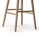 A midcentury-inspired counter stool gets refreshed with a modern memory swivel and chestnut top-grain leather. Slim, tapered oak legs balance a curved seat Amethyst Home provides interior design, new home construction design consulting, vintage area rugs, and lighting in the Alpharetta metro area.