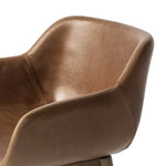 A midcentury-inspired counter stool gets refreshed with a modern memory swivel and chestnut top-grain leather. Slim, tapered oak legs balance a curved seat Amethyst Home provides interior design, new home construction design consulting, vintage area rugs, and lighting in the Nashville metro area.