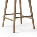 A midcentury-inspired counter stool gets refreshed with a modern memory swivel and chestnut top-grain leather. Slim, tapered oak legs balance a curved seat Amethyst Home provides interior design, new home construction design consulting, vintage area rugs, and lighting in the Portland metro area.