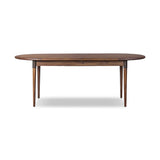 Design with flexibility. Finished in a warm toasted walnut, an oval acacia tabletop, cone-tapered legs and iron detailing speak to Scandinavian modernism. Expansion from 84" to 104" means more space when company calls Amethyst Home provides interior design, new home construction design consulting, vintage area rugs, and lighting in the Washington metro area.