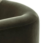 A true showstopper. A fully upholstered outer frame cradles this classic chair upholstered in a velvety olive fabric Amethyst Home provides interior design, new home construction design consulting, vintage area rugs, and lighting in the Charlotte metro area.