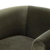 A true showstopper. A fully upholstered outer frame cradles this classic chair upholstered in a velvety olive fabric Amethyst Home provides interior design, new home construction design consulting, vintage area rugs, and lighting in the Laguna Beach metro area.