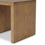 Simple waterfall shaping defined by subtle details. Grain-rich ash offers plenty of movement across the wood, meeting in a prominent scallop cutout detail on each edge for a bold addition of character to this end table. A design collaboration by Amber Lewis and Four Hands. Amethyst Home provides interior design, new home construction design consulting, vintage area rugs, and lighting in the Austin metro area.