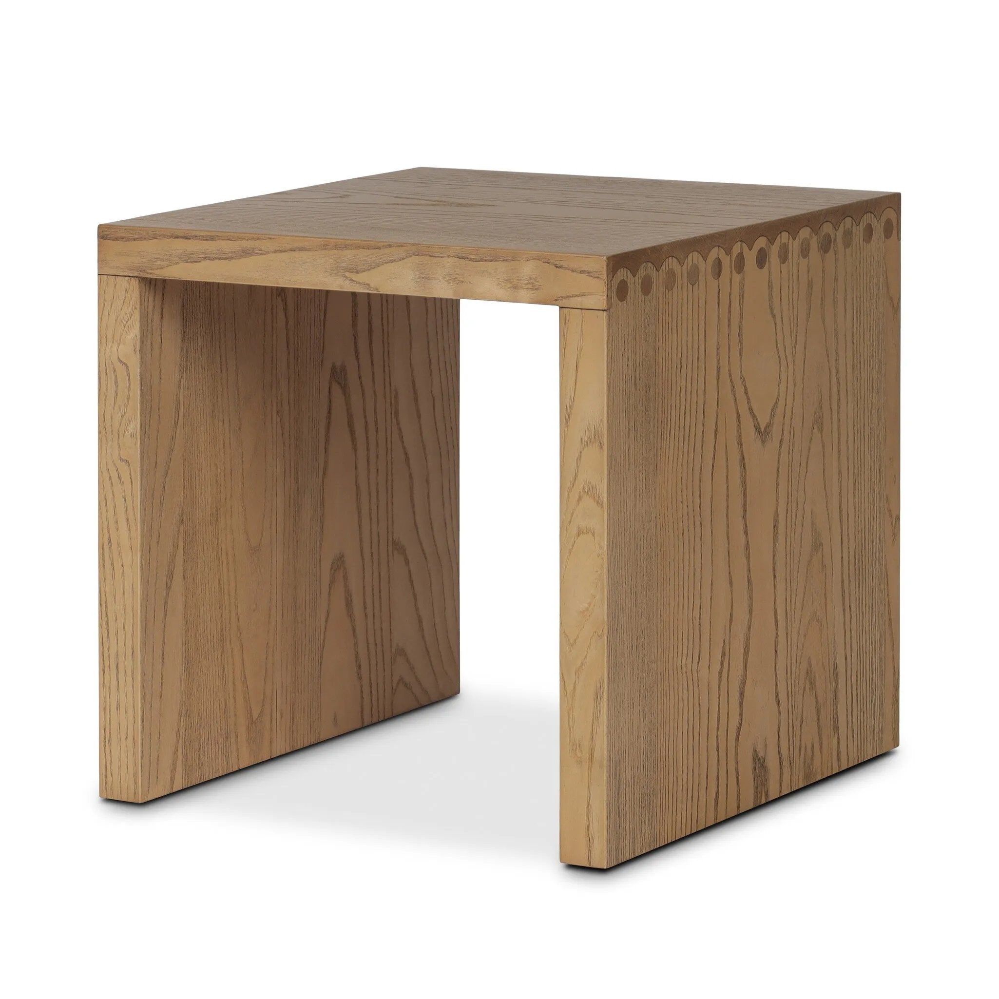 Simple waterfall shaping defined by subtle details. Grain-rich ash offers plenty of movement across the wood, meeting in a prominent scallop cutout detail on each edge for a bold addition of character to this end table. A design collaboration by Amber Lewis and Four Hands. Amethyst Home provides interior design, new home construction design consulting, vintage area rugs, and lighting in the Boston metro area.
