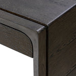 Featuring Henry Charcoal Oak Thick Veneer Desk by Four Hands at Amethyst Home. Made from solid reclaimed oak finished in a rustic charcoal, this slim-profile desk shapes subtly curved corners, bringing a handcrafted look to a minimalist form. Designed in partnership with longtime Four Hands collaborator Thomas Bina and Brazilian designer Ronald Sasson.Ove. Amethyst Home provides interior design, new home construction design consulting, vintage area rugs, and lighting in the Los Angeles metro area.