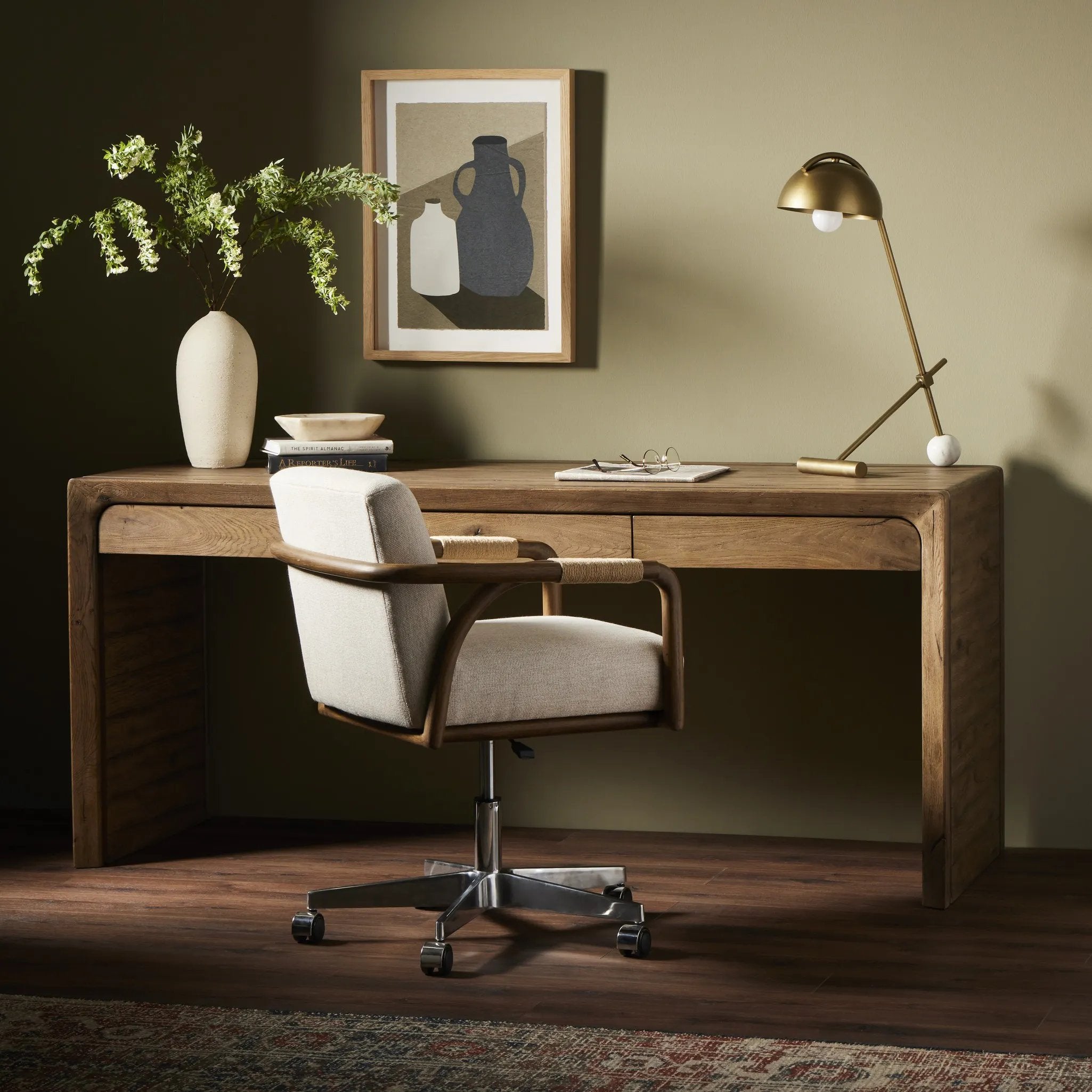 Featuring Henry Rustic Grey Veneer Desk by Four Hands at Amethyst Home. Made from solid reclaimed oak finished in a rustic grey, this slim-profile desk shapes subtly curved corners, bringing a handcrafted look to a minimalist form. Designed in partnership with longtime Four Hands collaborator Thomas Bina and Brazilian designer Ronald Sasson.Overall Dimens. Amethyst Home provides interior design, new home construction design consulting, vintage area rugs, and lighting in the Kansas City metro area.