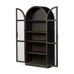 Featuring Hepburn Dark Anthracite Oak Veneer Cabinet by Four Hands at Amethyst Home. Beautifully arched with a flush plinth base, a versatile oak cabinet features a dark, rich finish. With generous interior shelving, a tempered glass front allows you to showcase favorite books and treasures — letting anyone who enters your space know exactly who you are. Ov. Amethyst Home provides interior design, new home construction design consulting, vintage area rugs, and lighting in the Nashville metro area.