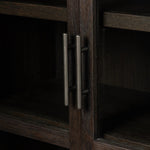 Featuring Hepburn Dark Anthracite Oak Veneer Cabinet by Four Hands at Amethyst Home. Beautifully arched with a flush plinth base, a versatile oak cabinet features a dark, rich finish. With generous interior shelving, a tempered glass front allows you to showcase favorite books and treasures — letting anyone who enters your space know exactly who you are. Ov. Amethyst Home provides interior design, new home construction design consulting, vintage area rugs, and lighting in the San Diego metro area.