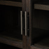Featuring Hepburn Dark Anthracite Oak Veneer Cabinet by Four Hands at Amethyst Home. Beautifully arched with a flush plinth base, a versatile oak cabinet features a dark, rich finish. With generous interior shelving, a tempered glass front allows you to showcase favorite books and treasures — letting anyone who enters your space know exactly who you are. Ov. Amethyst Home provides interior design, new home construction design consulting, vintage area rugs, and lighting in the San Diego metro area.