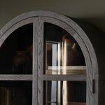 Featuring Hepburn Dark Anthracite Oak Veneer Cabinet by Four Hands at Amethyst Home. Beautifully arched with a flush plinth base, a versatile oak cabinet features a dark, rich finish. With generous interior shelving, a tempered glass front allows you to showcase favorite books and treasures — letting anyone who enters your space know exactly who you are. O. Amethyst Home provides interior design, new home construction design consulting, vintage area rugs, and lighting in the Washington metro area.