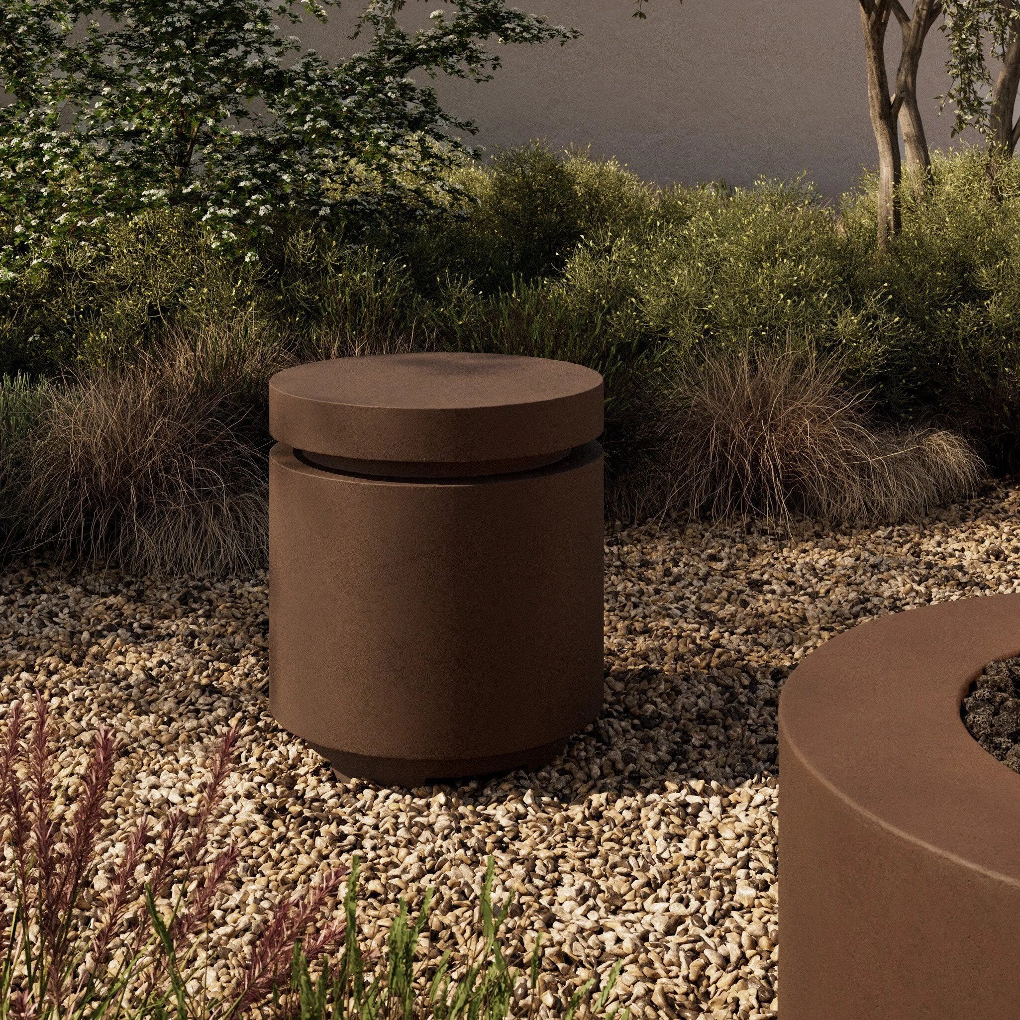 This outdoor propane tank enclosure pairs with fire tables for a clean, seamless look. Made from glass-reinforced concrete, each piece is naturally finished with deep tones of pewter and dark grey. It can act as an end table with its lid on, and has cutouts at the base for hose attachments. Amethyst Home provides interior design, new home construction design consulting, vintage area rugs, and lighting in the Monterey metro area.