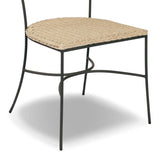 A light, airy take on the traditional bistro shape. This outdoor dining chair features exaggerated splayed legs and a curved X-shaped stretcher, with a handle detail cut out of the woven seat back. Finished with a seat cushion. Cover or store indoors during inclement weather and when not in use. Amethyst Home provides interior design, new home construction design consulting, vintage area rugs, and lighting in the Monterey metro area.