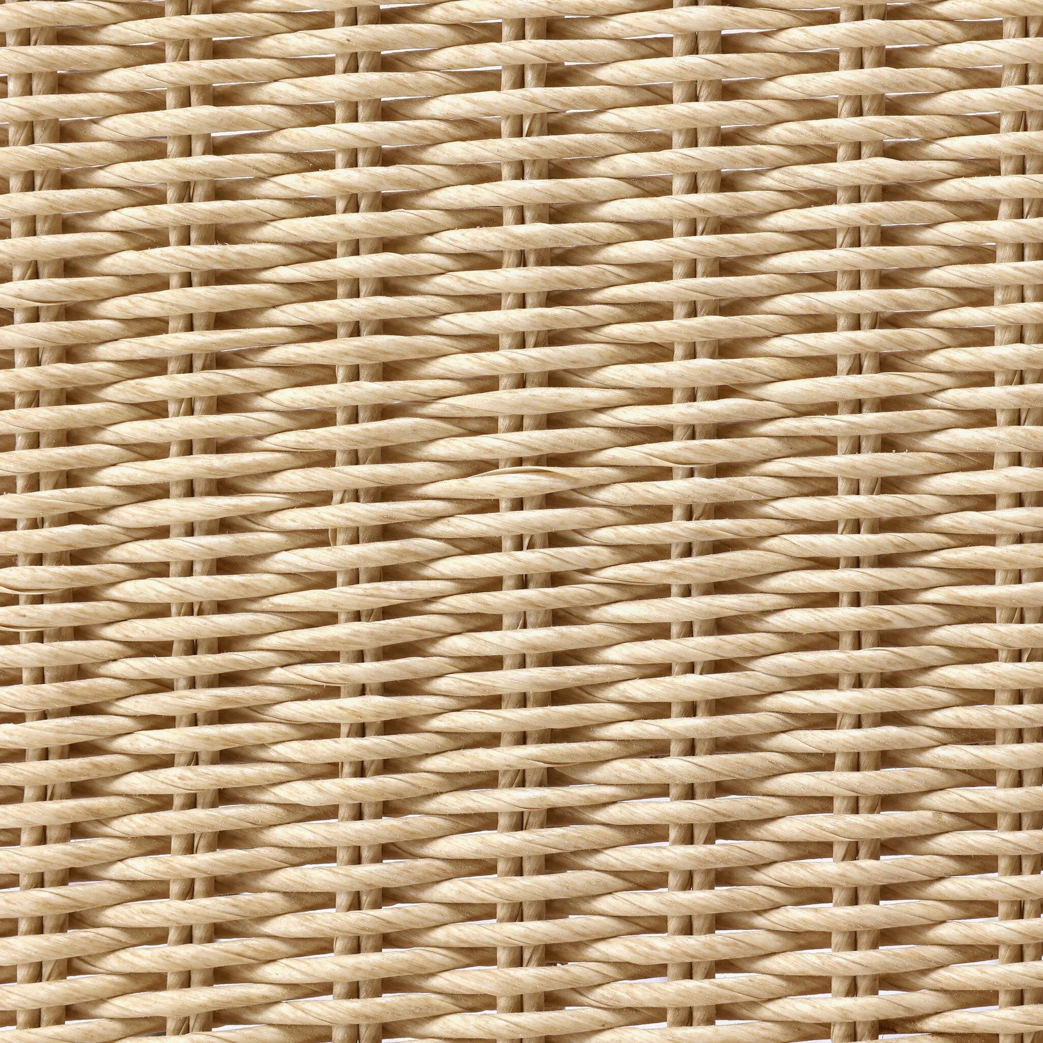 A light, airy take on the traditional bistro shape. This outdoor dining chair features exaggerated splayed legs and a curved X-shaped stretcher, with a handle detail cut out of the woven seat back. Finished with a seat cushion. Cover or store indoors during inclement weather and when not in use. Amethyst Home provides interior design, new home construction design consulting, vintage area rugs, and lighting in the Seattle metro area.