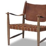 Featuring Ignacio Renault Cognac Chair by Four Hands at Amethyst Home. Reviving a vintage-inspired frame, this leather sling chair meets retro character with laid-back comfort. The tan leather sling back, shaped like a shield, adds bold style, while the woven seat provides a supportive, unique seating experience. Crafted from an ash wood frame with dowel co. Amethyst Home provides interior design, new home construction design consulting, vintage area rugs, and lighting in the Calabasas metro area.