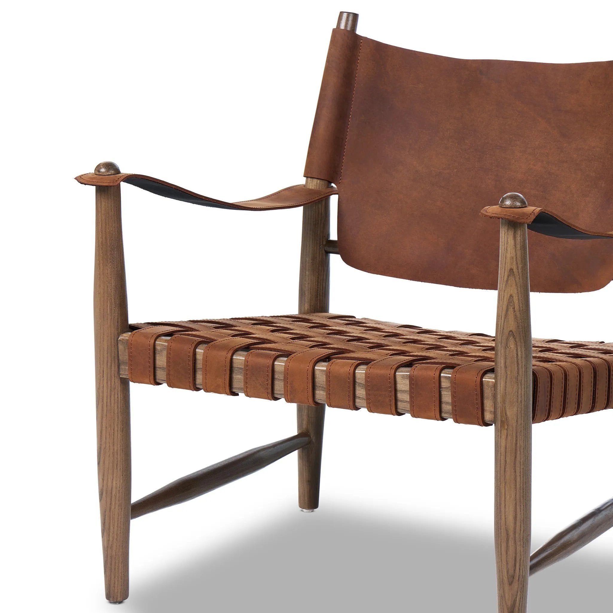 Featuring Ignacio Renault Cognac Chair by Four Hands at Amethyst Home. Reviving a vintage-inspired frame, this leather sling chair meets retro character with laid-back comfort. The tan leather sling back, shaped like a shield, adds bold style, while the woven seat provides a supportive, unique seating experience. Crafted from an ash wood frame with dowel co. Amethyst Home provides interior design, new home construction design consulting, vintage area rugs, and lighting in the Calabasas metro area.