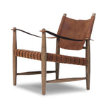 Featuring Ignacio Renault Cognac Chair by Four Hands at Amethyst Home. Reviving a vintage-inspired frame, this leather sling chair meets retro character with laid-back comfort. The tan leather sling back, shaped like a shield, adds bold style, while the woven seat provides a supportive, unique seating experience. Crafted from an ash wood frame with dowel . Amethyst Home provides interior design, new home construction design consulting, vintage area rugs, and lighting in the Kansas City metro area.