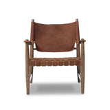 Featuring Ignacio Renault Cognac Chair by Four Hands at Amethyst Home. Reviving a vintage-inspired frame, this leather sling chair meets retro character with laid-back comfort. The tan leather sling back, shaped like a shield, adds bold style, while the woven seat provides a supportive, unique seating experience. Crafted from an ash wood frame with dowel. Amethyst Home provides interior design, new home construction design consulting, vintage area rugs, and lighting in the Laguna Beach metro area.