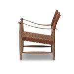 Featuring Ignacio Renault Cognac Chair by Four Hands at Amethyst Home. Reviving a vintage-inspired frame, this leather sling chair meets retro character with laid-back comfort. The tan leather sling back, shaped like a shield, adds bold style, while the woven seat provides a supportive, unique seating experience. Crafted from an ash wood frame with dowe. Amethyst Home provides interior design, new home construction design consulting, vintage area rugs, and lighting in the Newport Beach metro area.