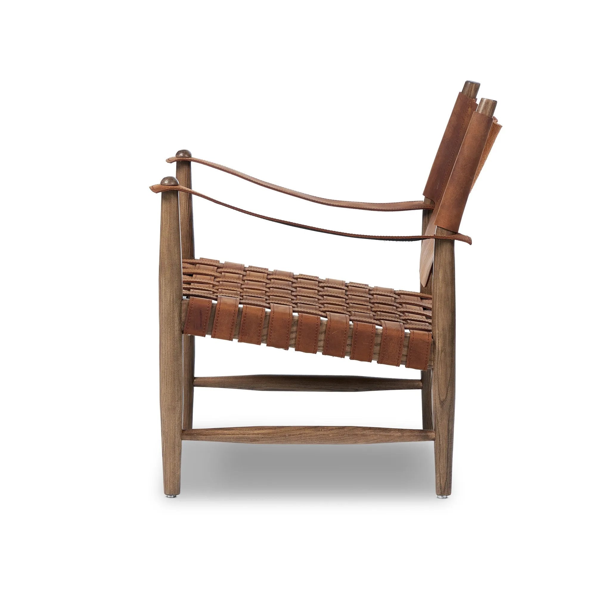 Featuring Ignacio Renault Cognac Chair by Four Hands at Amethyst Home. Reviving a vintage-inspired frame, this leather sling chair meets retro character with laid-back comfort. The tan leather sling back, shaped like a shield, adds bold style, while the woven seat provides a supportive, unique seating experience. Crafted from an ash wood frame with dowe. Amethyst Home provides interior design, new home construction design consulting, vintage area rugs, and lighting in the Newport Beach metro area.