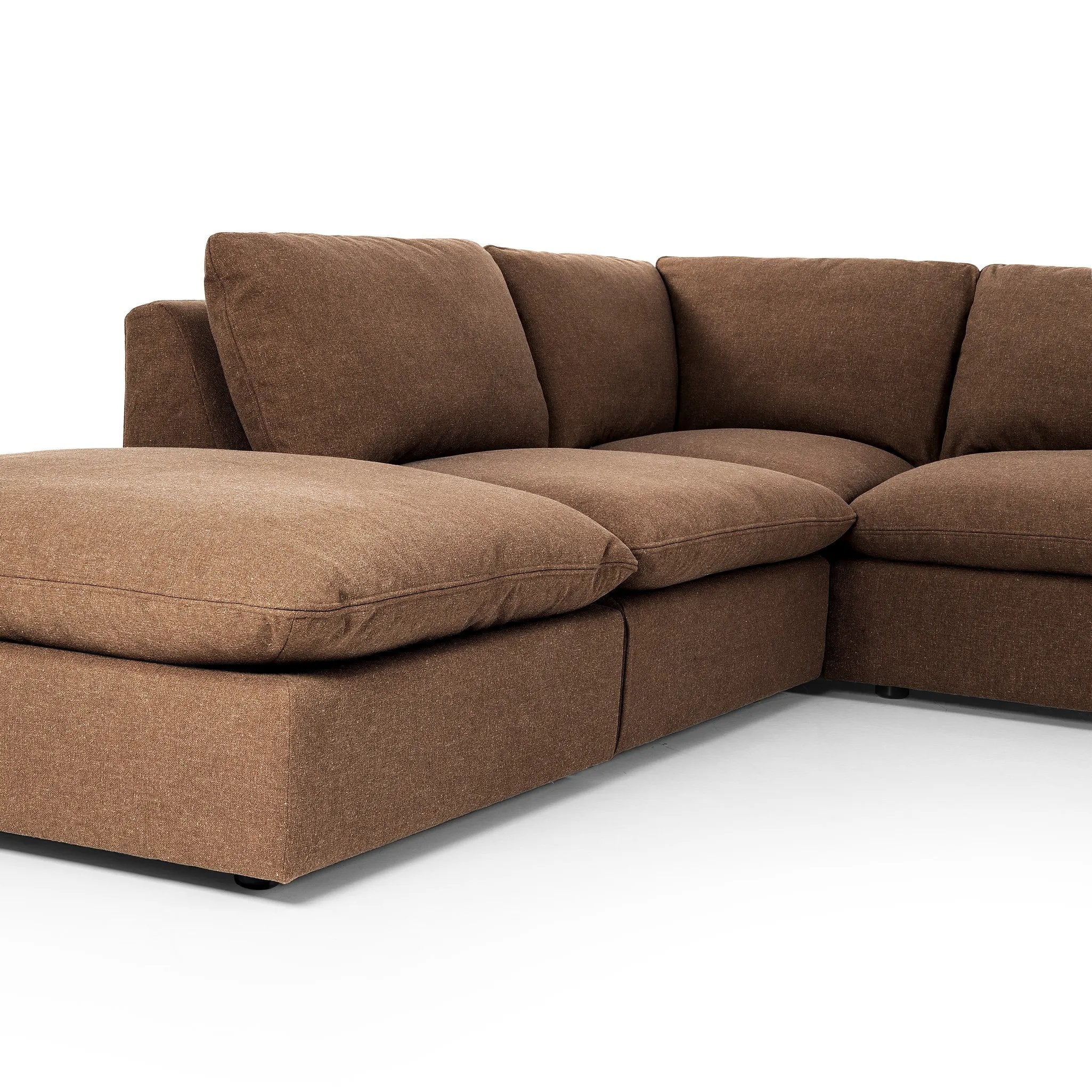 Inflated, pillow-inspired cushioning all around brings cozy comfort to the room. High-performance linen offers the best of both worlds on this plush and welcoming sectional. Amethyst Home provides interior design, new home construction design consulting, vintage area rugs, and lighting in the Calabasas metro area.