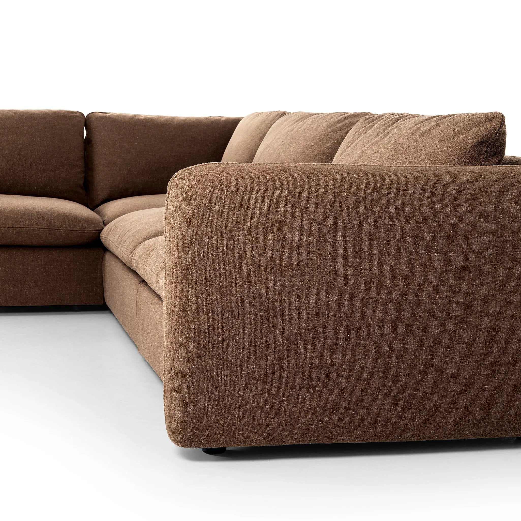Inflated, pillow-inspired cushioning all around brings cozy comfort to the room. High-performance linen offers the best of both worlds on this plush and welcoming sectional. Amethyst Home provides interior design, new home construction design consulting, vintage area rugs, and lighting in the Charlotte metro area.